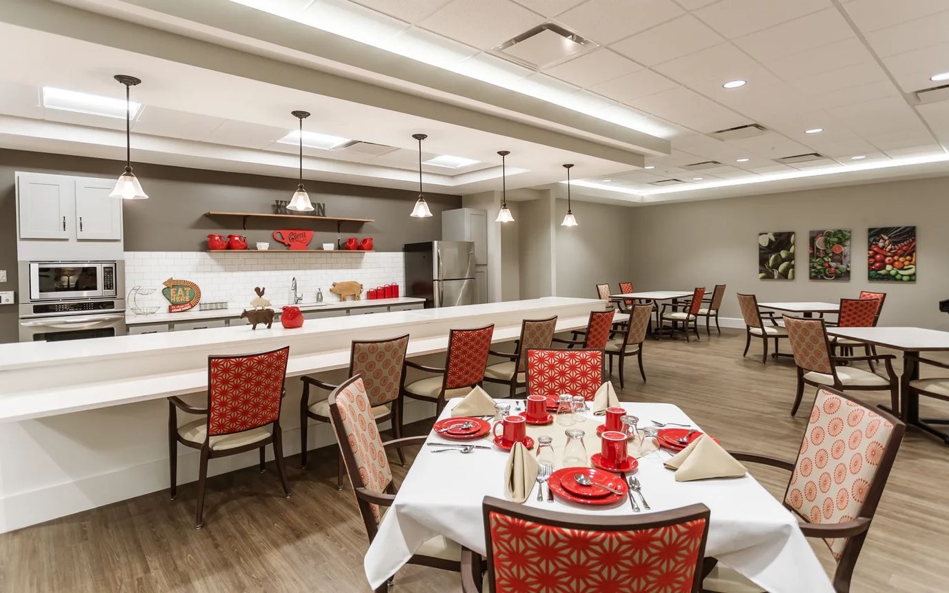 Brightly decorated dining room with tables set for a meal