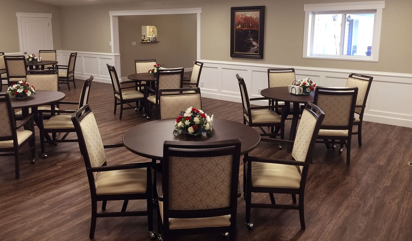 Interior view of the dining room with tables and floral centerpieces