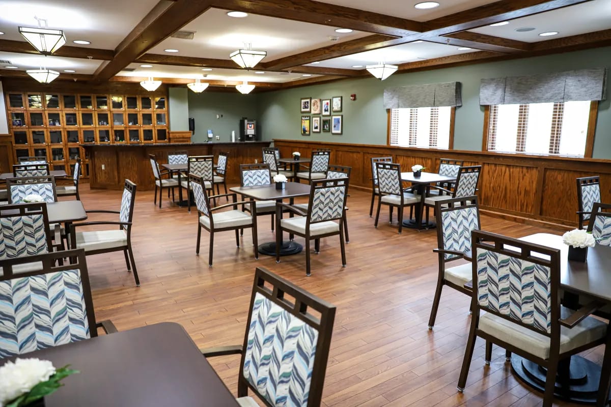 Dining area with tables and chairs in a common room