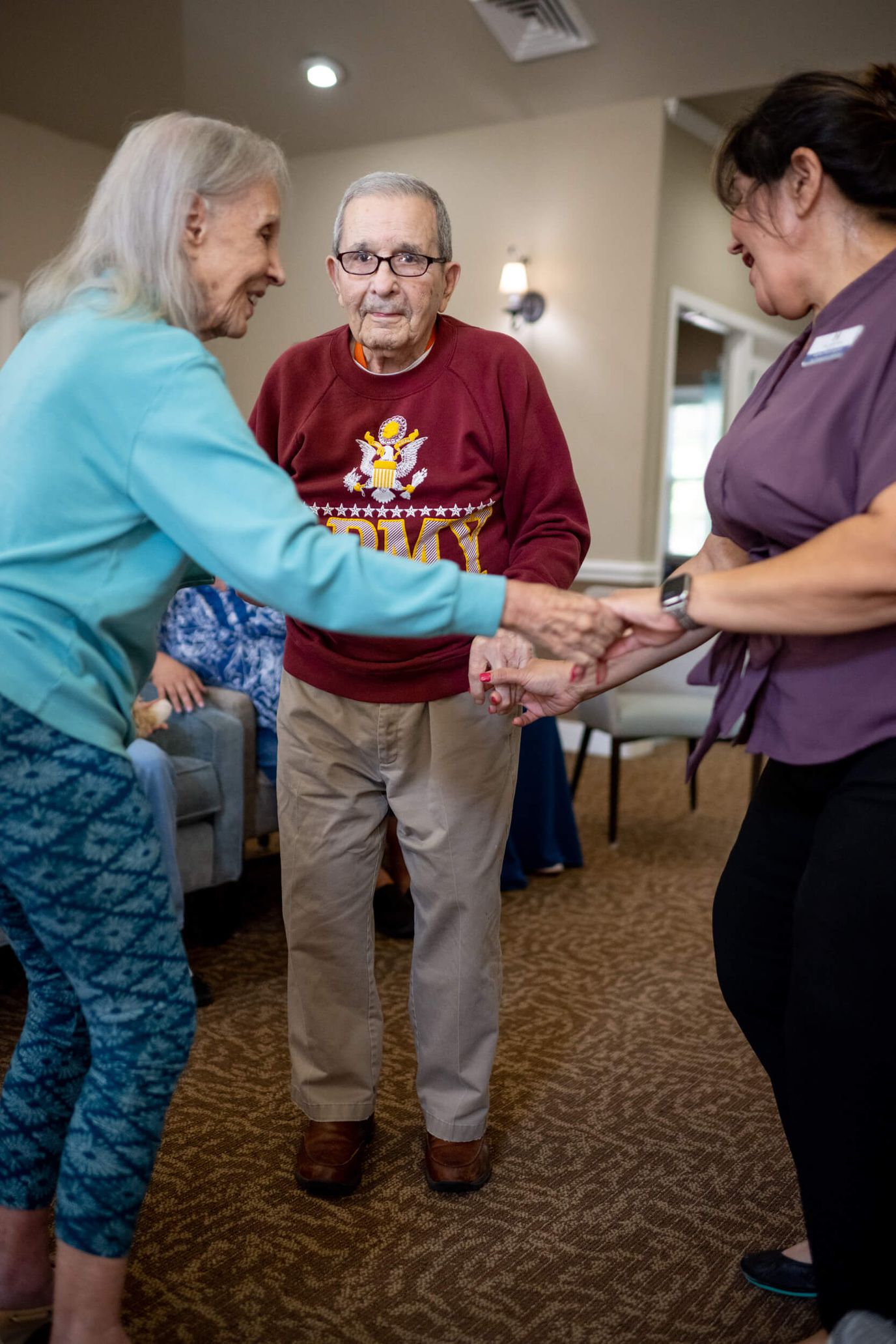 Residents engaging in an activity with staff