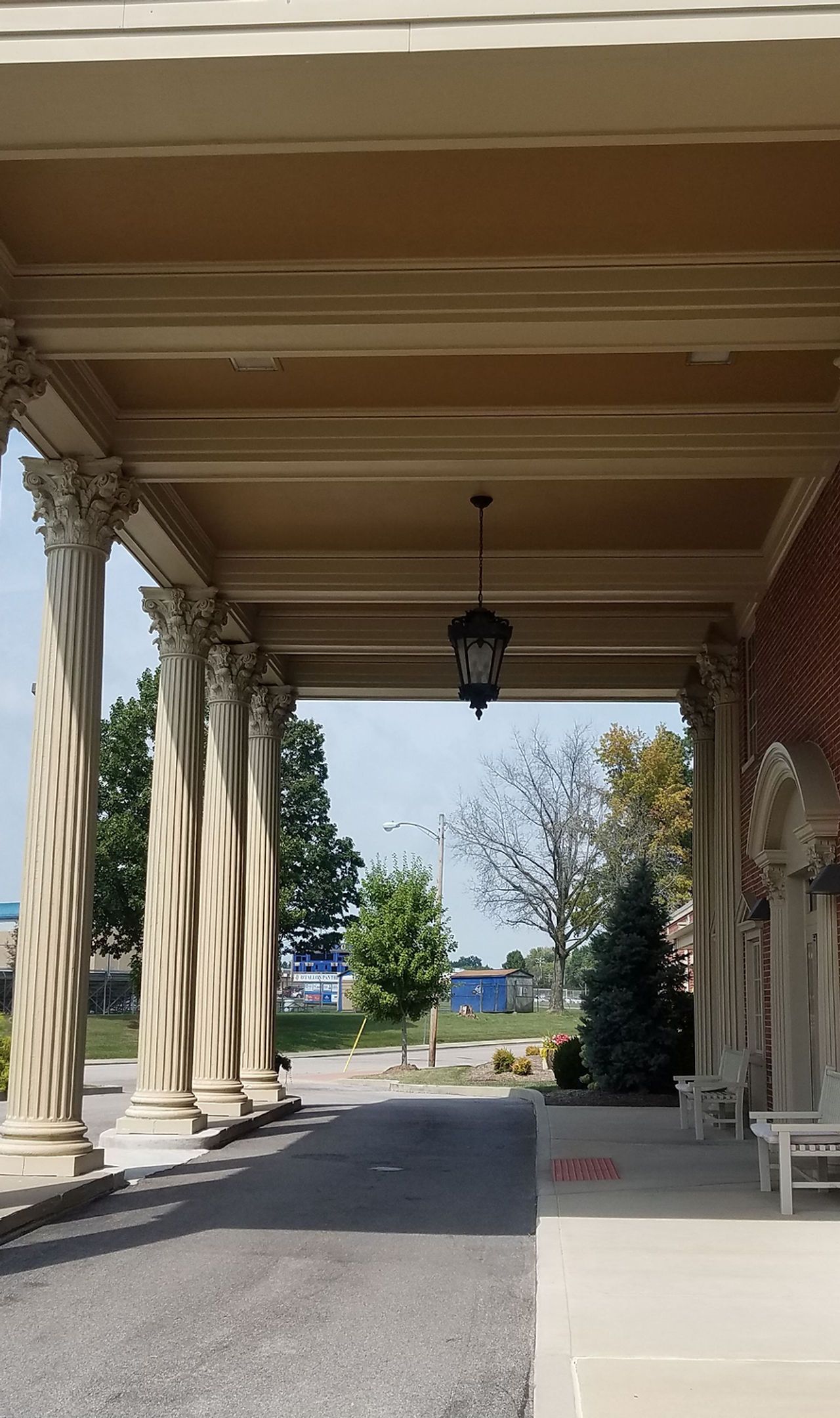 Entrance of a senior living facility under colonnade.