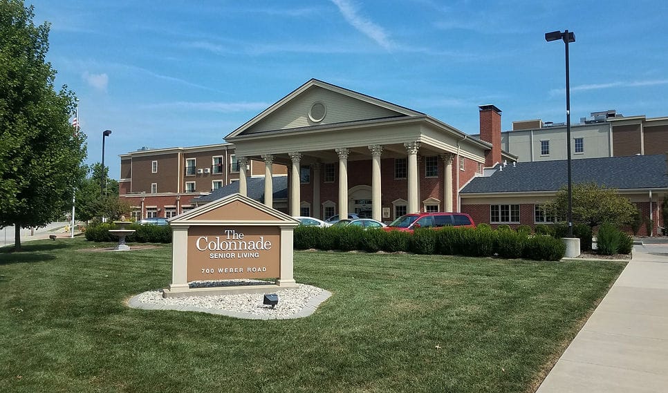 Front view of The Colonnade Senior Living facility