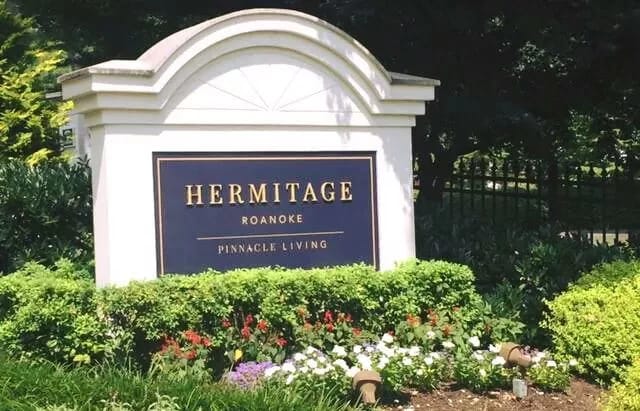 Hermitage Roanoke entrance sign surrounded by flowers