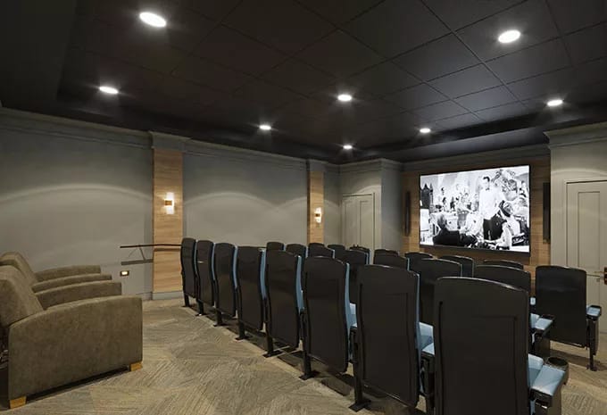 Interior view of the theater room with seating and a large screen
