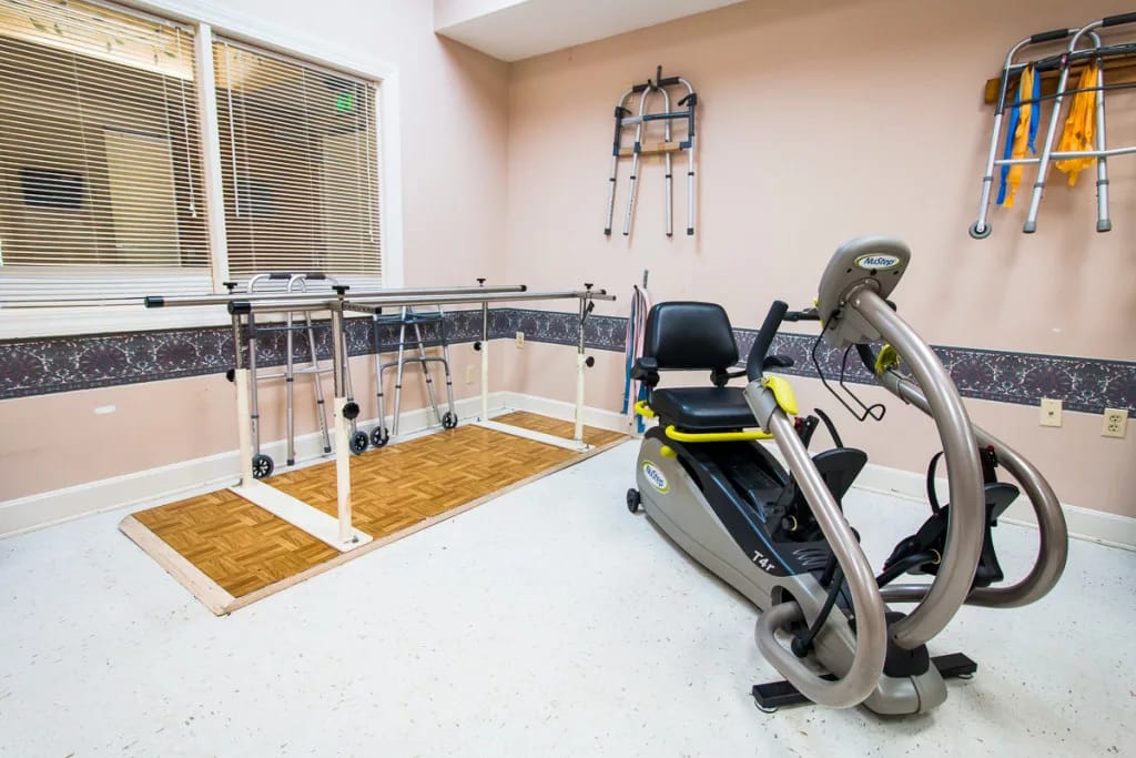 Rehabilitation gym featuring exercise equipment and walking bars