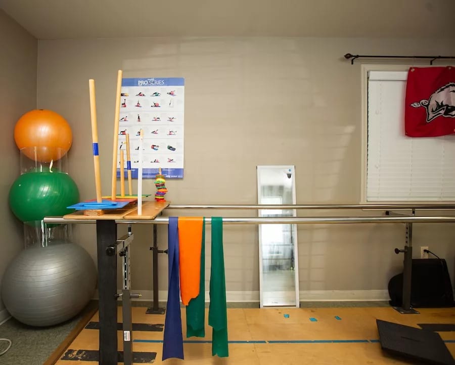 Therapy room with exercise equipment and colorful props