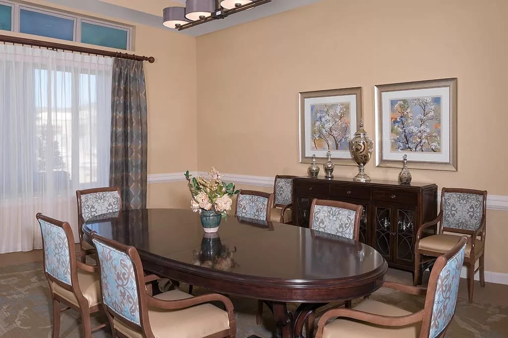Elegant dining room with a round table and decorative chairs