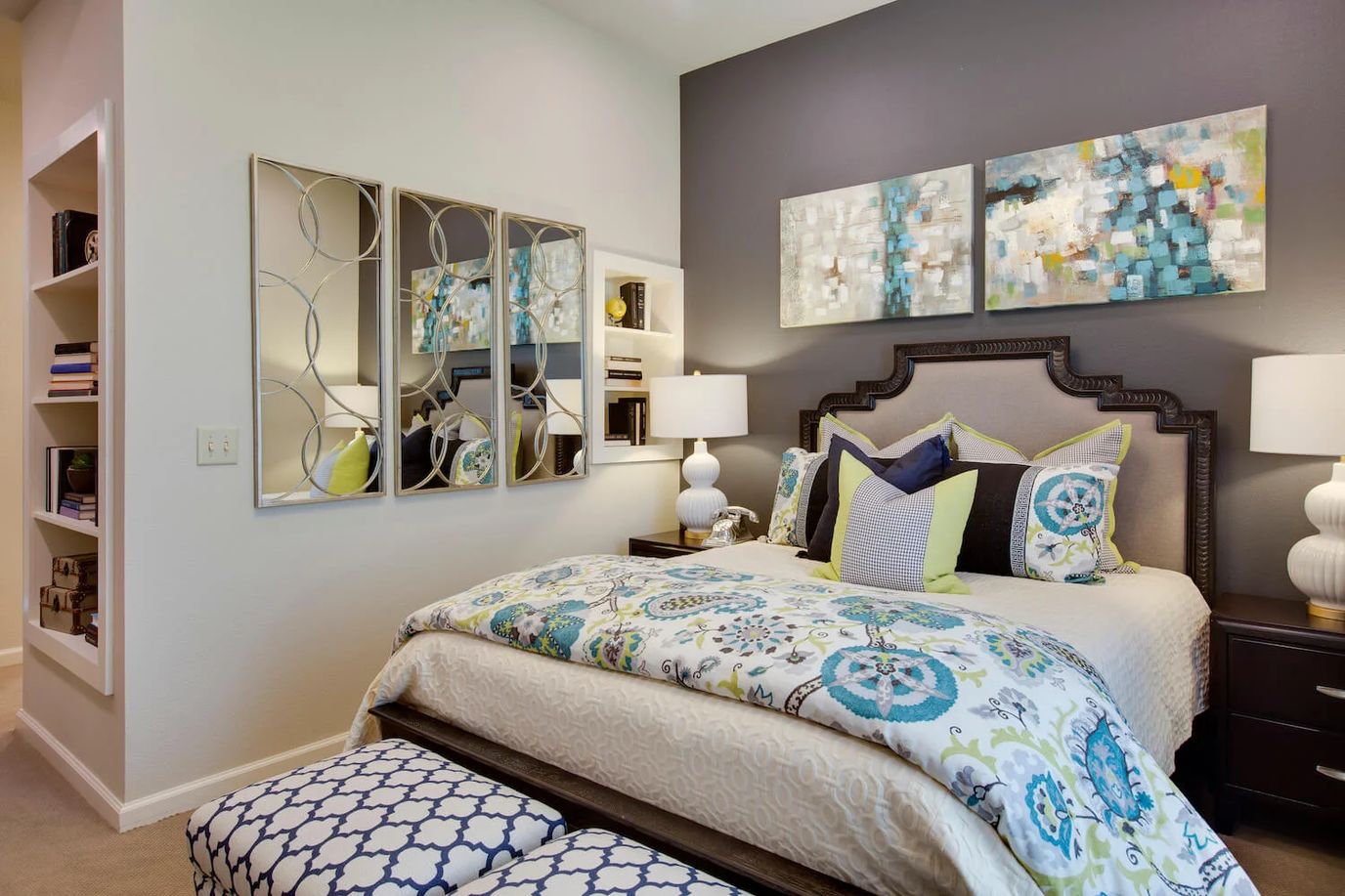 Stylishly decorated bedroom with colorful bedding and art