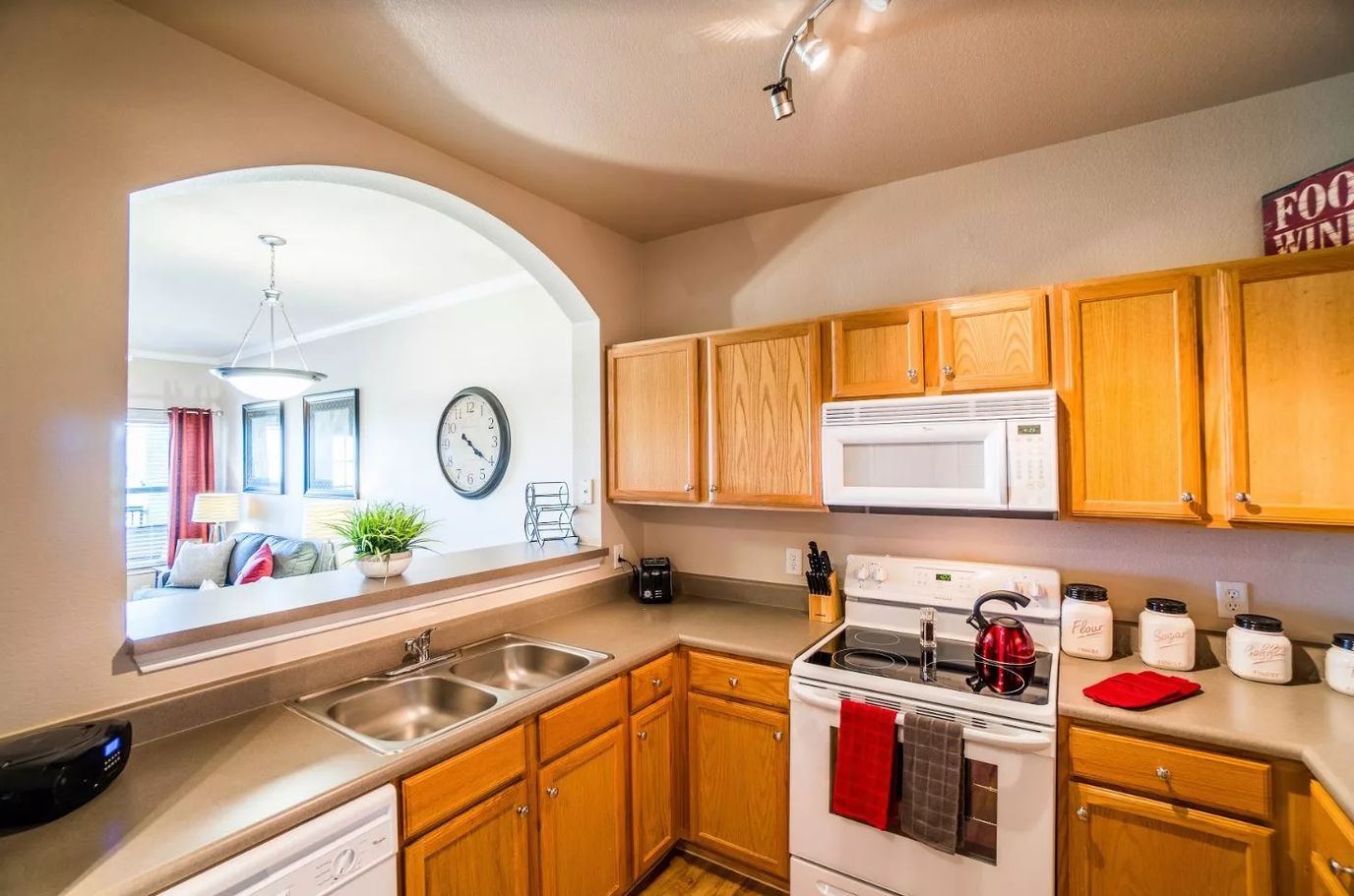 Bright kitchen with wooden cabinets and modern appliances