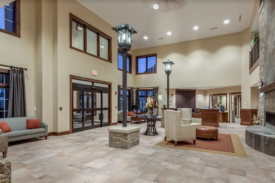 Spacious lobby with seating area and decorative lamps