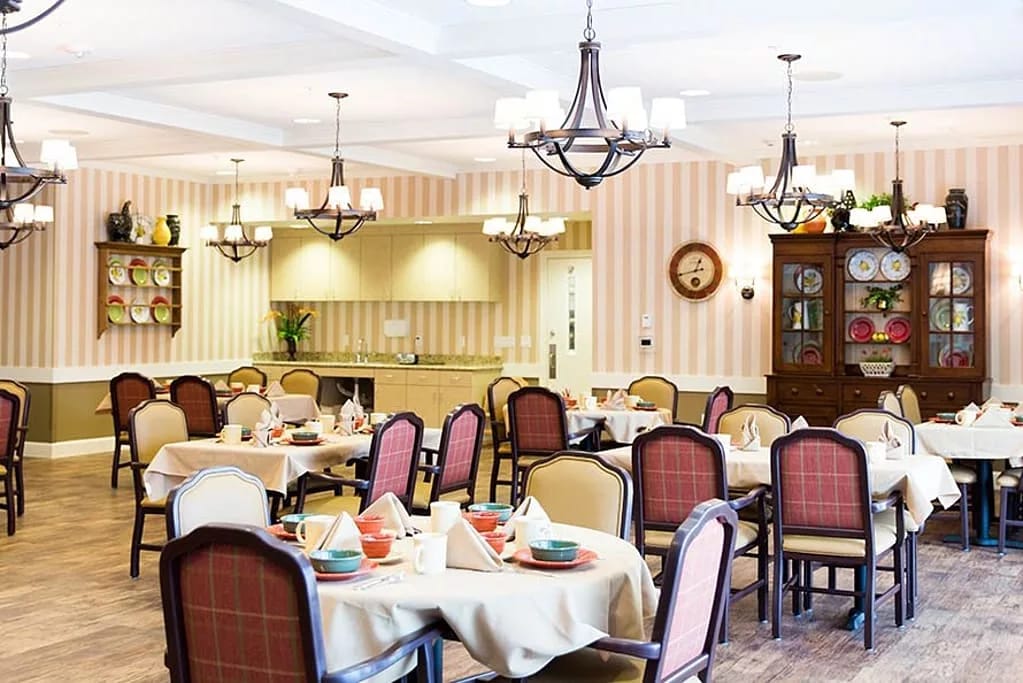 Bright dining room with tables set for meals