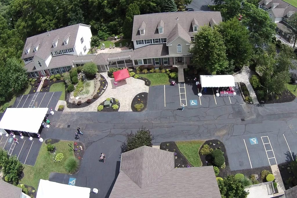 Aerial view of Heritage Villas featuring gardens and parking areas