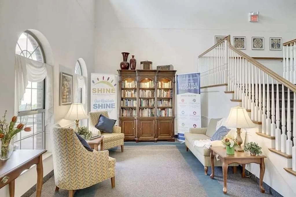 Bright and inviting lobby area with seating and bookshelves