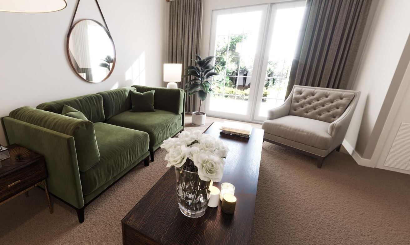 Stylish living room featuring a green sofa, a chair, and a coffee table with flowers.