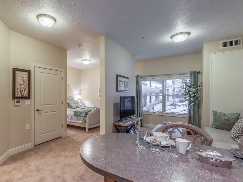 Bright living area with dining table and cozy seating