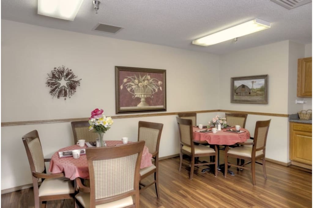 Cozy dining area with tables set for meals