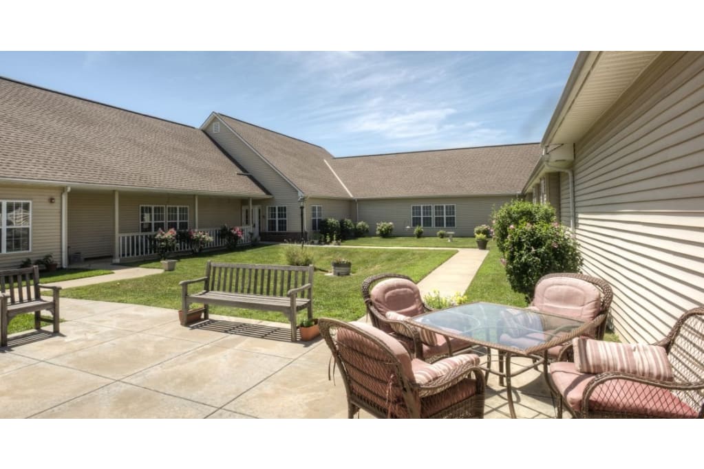 Outdoor seating area with benches and a table