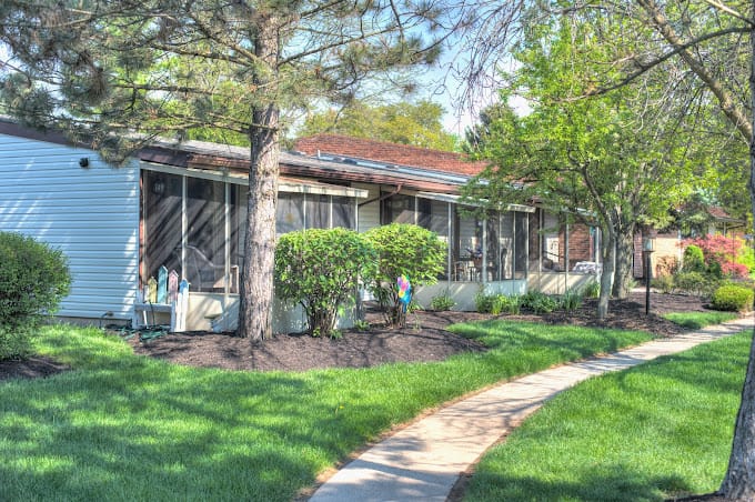 Exterior of Springfield Assisted Living with landscaped garden and pathway