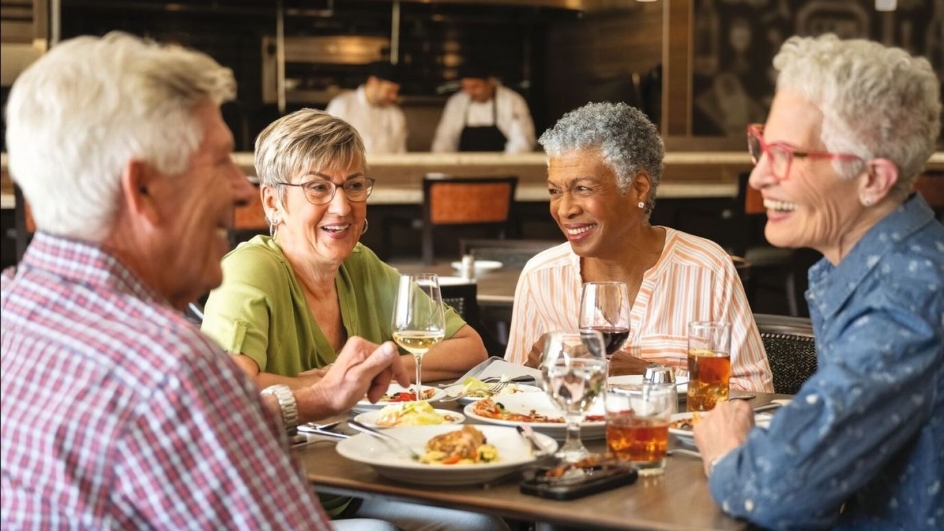 Residents enjoying a meal together in the dining room