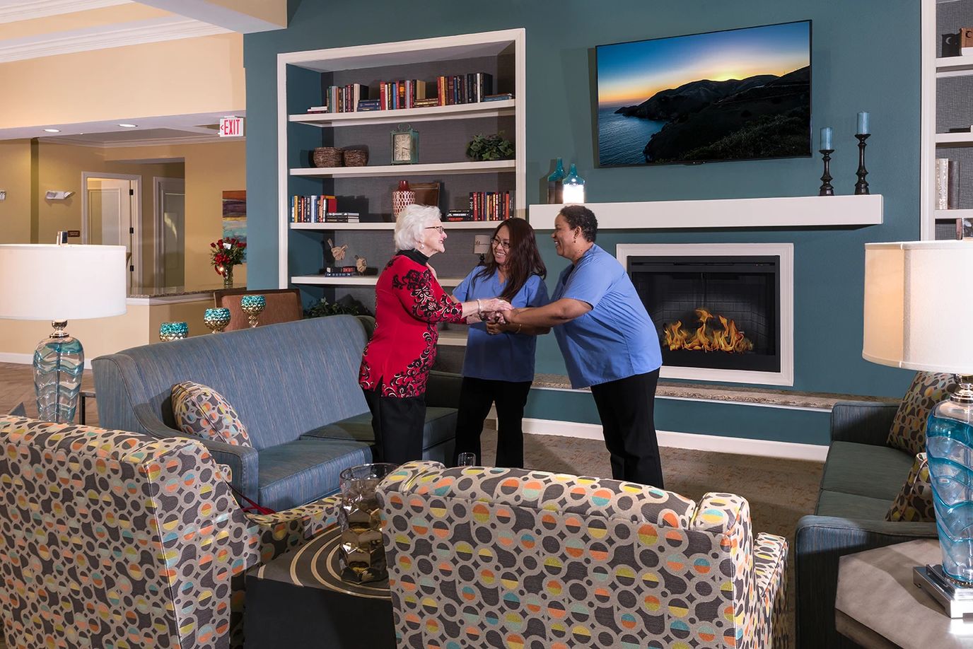 Residents and staff interacting in a cozy common area