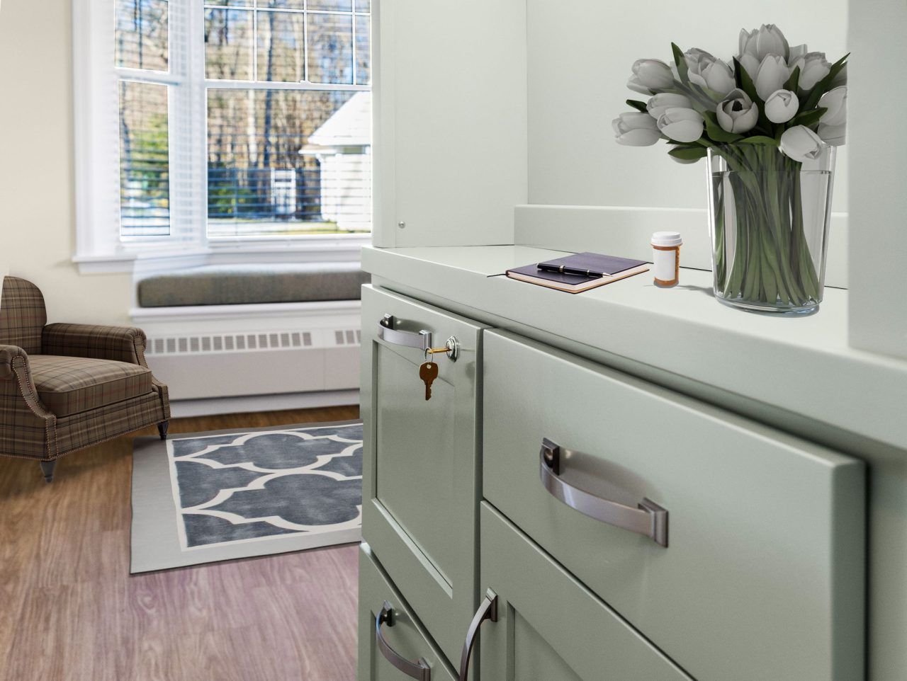 Interior photo of a resident's room with floral arrangement