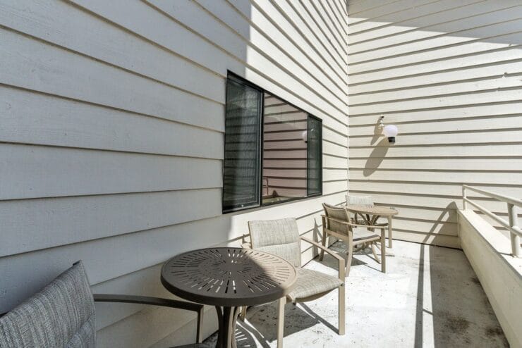 Outdoor seating area with tables and chairs.
