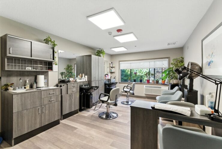 Beauty salon area with chairs and plants