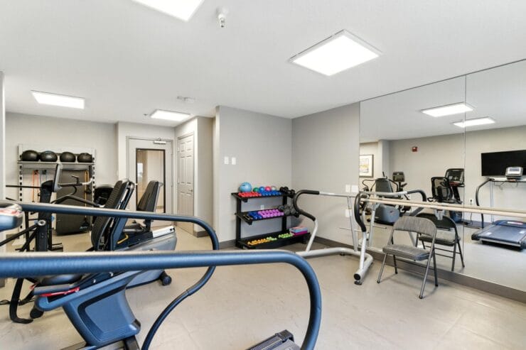 Interior view of a gym with exercise equipment.