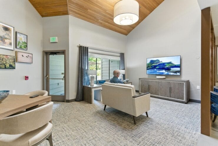 Resident relaxing in a common area of the facility.