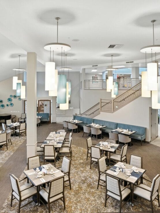Dining area with set tables and modern decor.