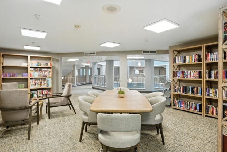Interior view of a common reading area with bookshelves.