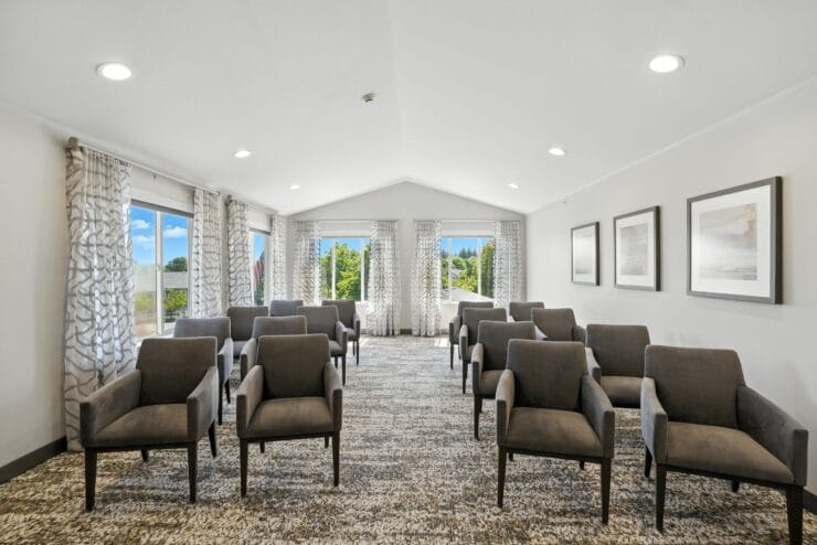 Interior common area with chairs and windows.