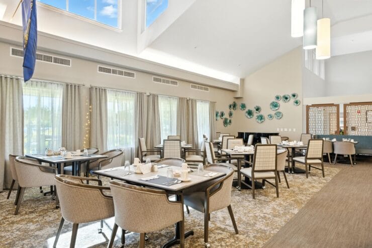 Elegant dining room with tables set for meals.