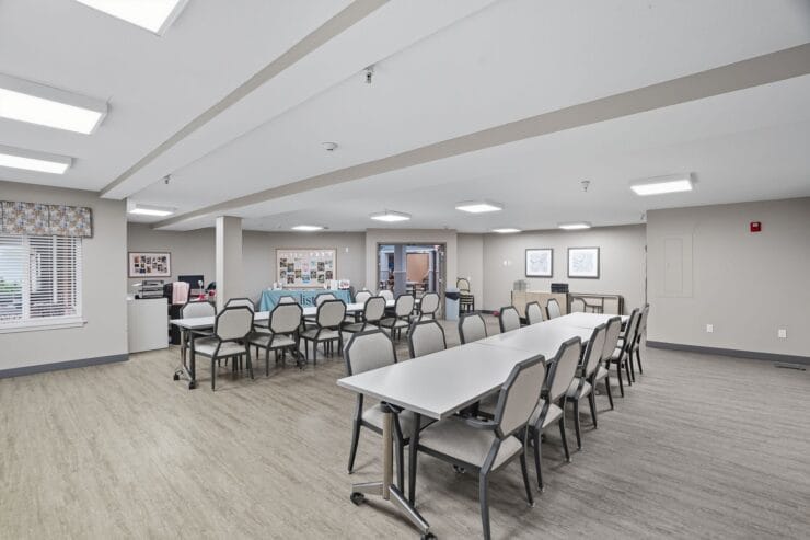 Bright, spacious common area with tables and chairs