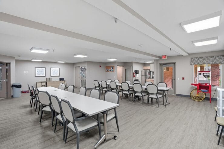 Dining area with tables and chairs in interior space.