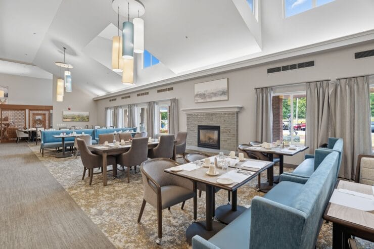 Modern dining room with seating and décor.