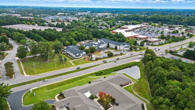 Aerial view of an assisted living facility and surrounding areas.