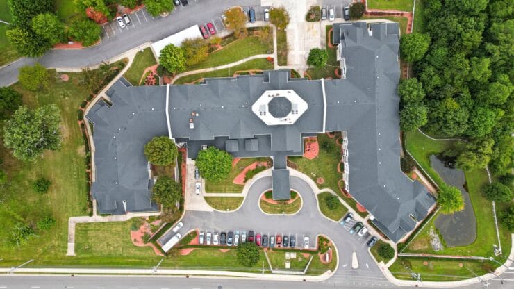 Aerial view of the facility building and surrounding landscape.