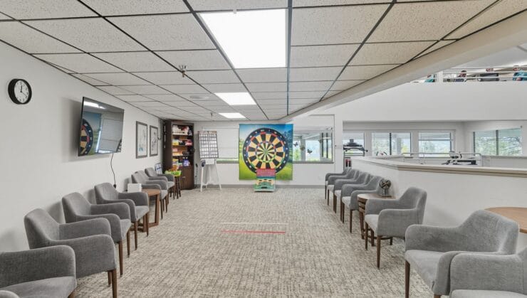 Common area with dartboard and seating