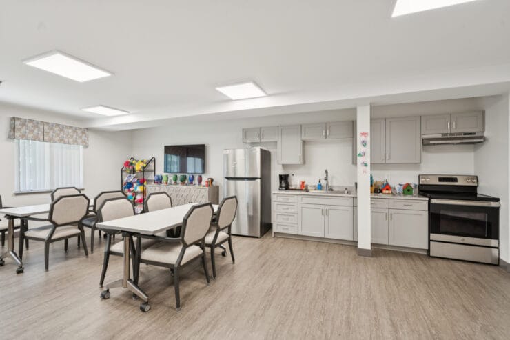 Bright common area with kitchen facilities.