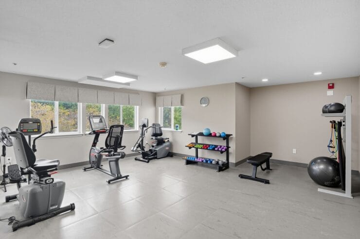 Well-equipped exercise room with fitness equipment.