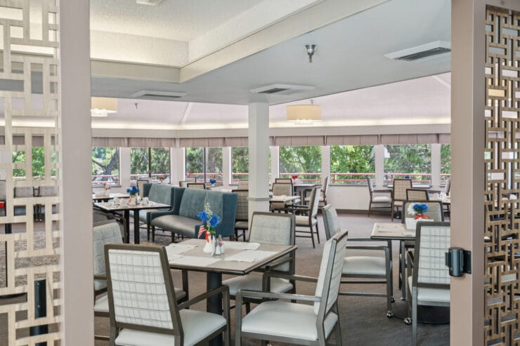Bright dining room with tables set for service.