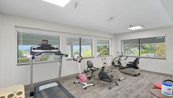 Well-equipped exercise room with various equipment