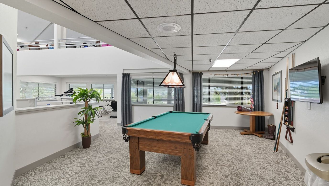 Interior view of a recreational area with a pool table.