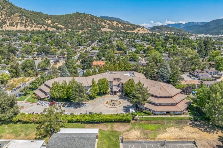Aerial view of a nursing home facility with landscaped grounds.
