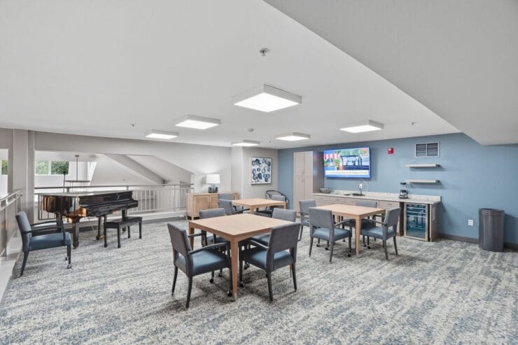 Interior common area with tables and piano