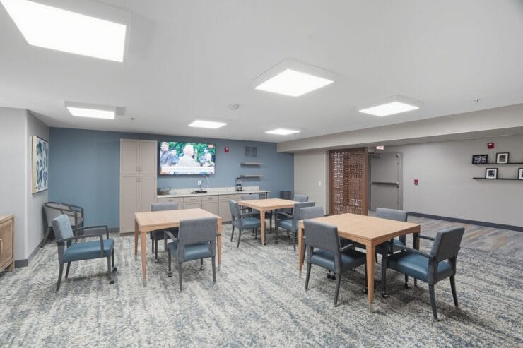 Interior common area with tables and TV.