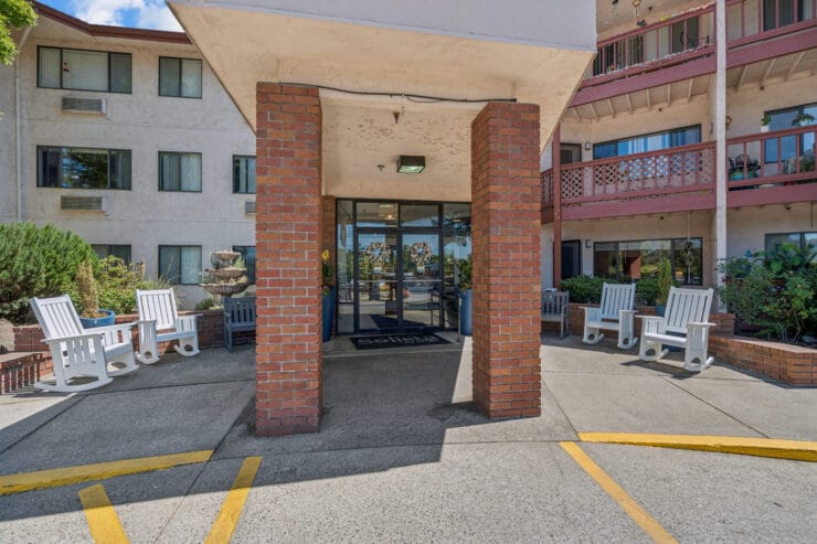Entrance area with seating and landscaping