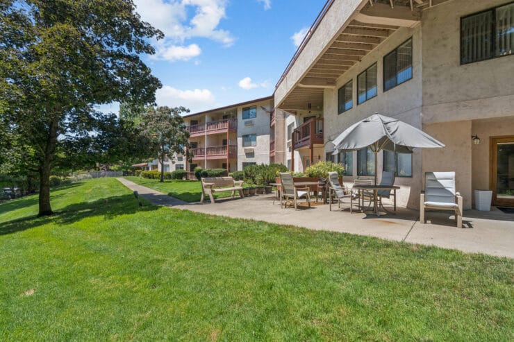 Outdoor area with seating and buildings in view.