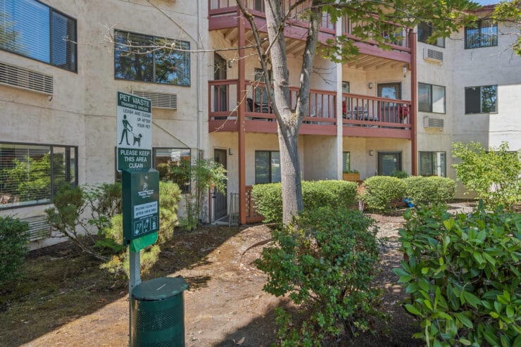 Outdoor area with building and landscaping.
